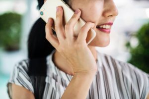 Close up of women calling someone on the phone