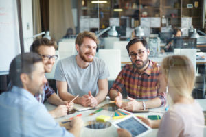 Colleagues talking in a circle together