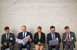 group waiting in line for job