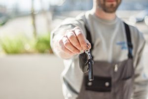 Men handing over keys